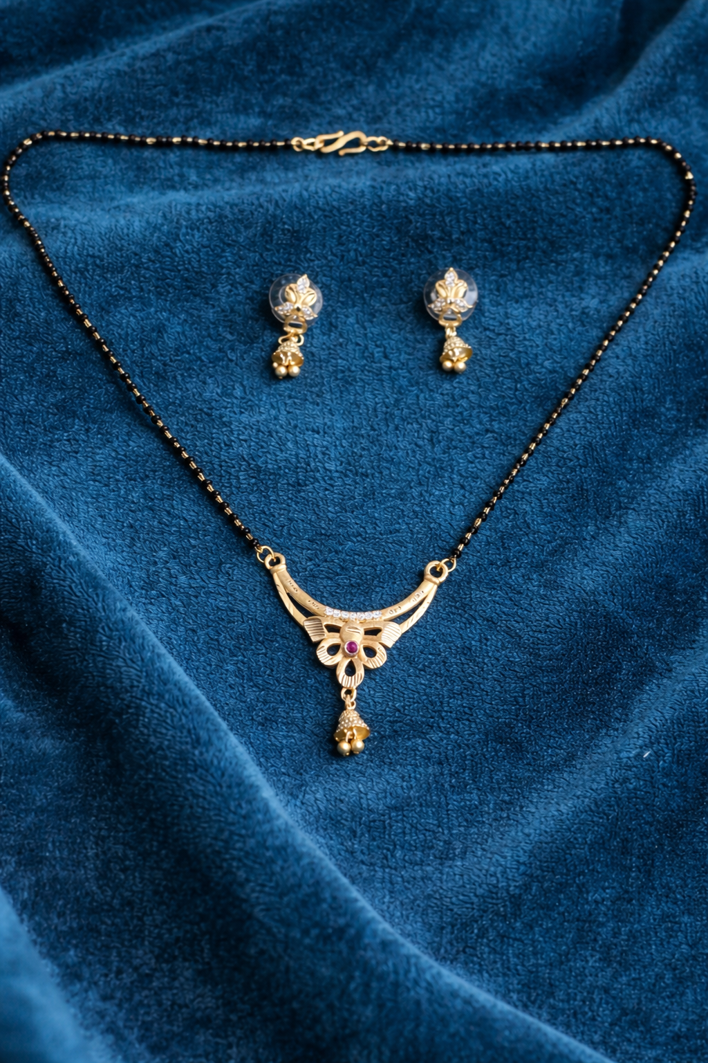 Gold-Plated Floral Mangalsutra Set with American Diamond, Ruby Stone and Matching Jhumki Earrings for Women
