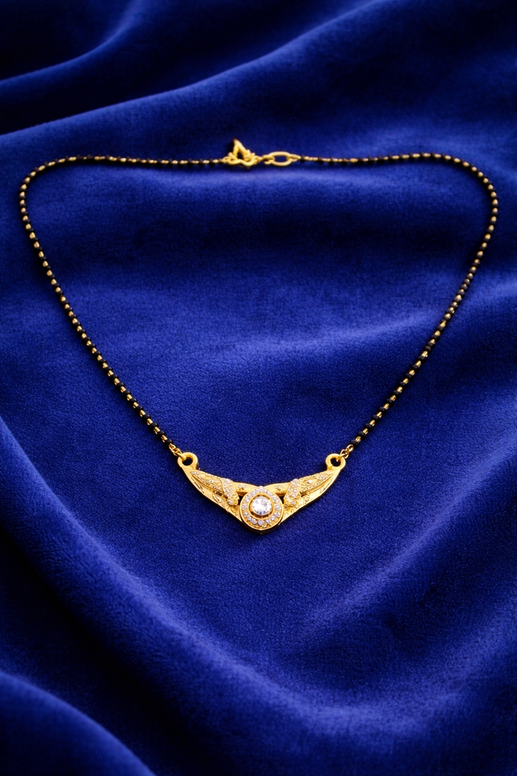 Gold-Plated Traditional Mangalsutra with American Diamond Round Pendant and Black Beaded Chain for Women