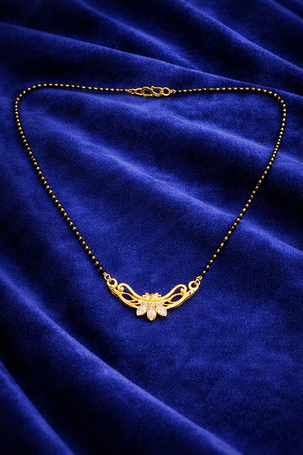 Gold-Plated Traditional Mangalsutra with American Diamond Floral Pendant and Black Beaded Chain for Women