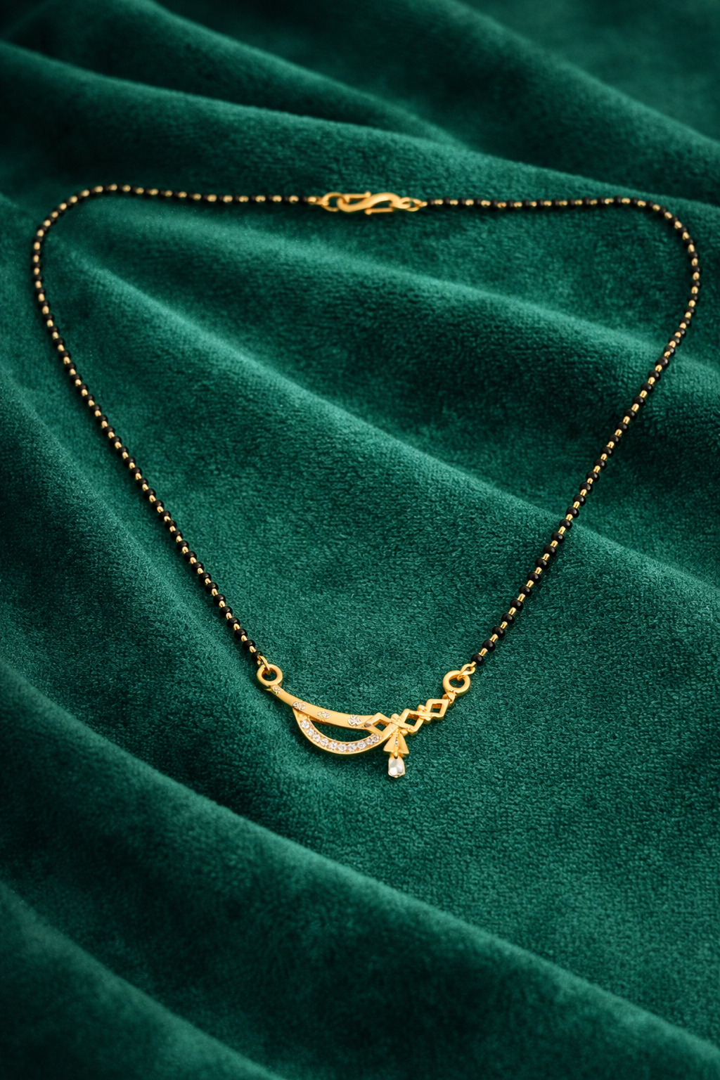 Gold-Plated Traditional Mangalsutra with American Diamond Curved Pendant and Black Beaded Chain for Women