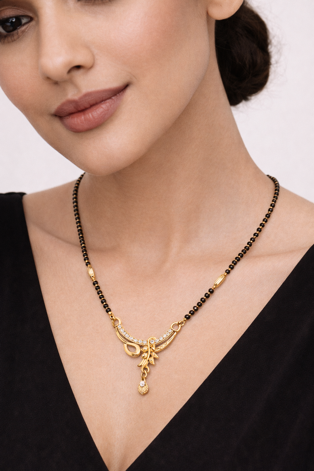 Gold-Plated Curved Designer Mangalsutra with American Diamond Drop Pendant for Women