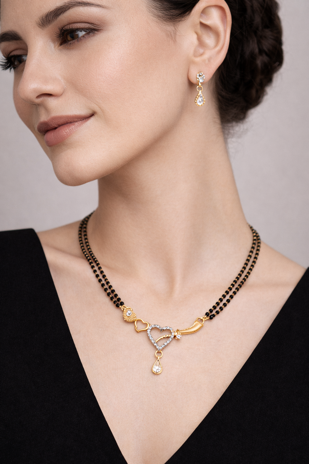 Gold-Plated Double Line Heart Design Mangalsutra with American Diamond Pendant for Women