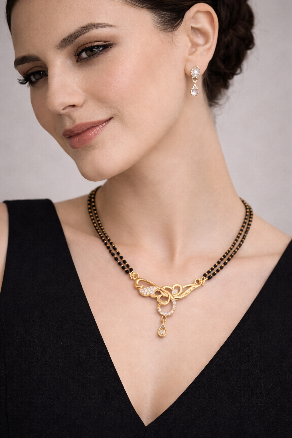 Gold-Plated Double Line Mangalsutra with American Diamond Twist Pendant for Women