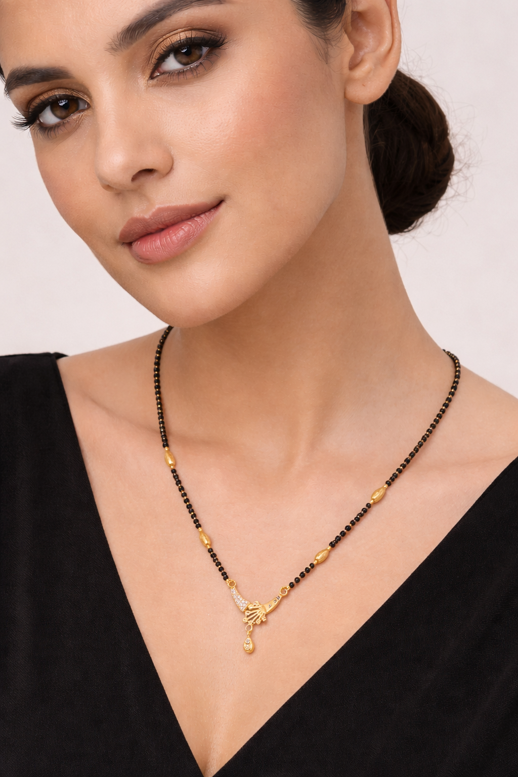 Gold-Plated Designer Mangalsutra with American Diamond Pendant and Black Bead Chain for Women