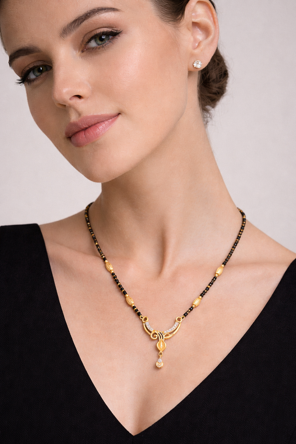 Gold-Plated Curved Leaf Mangalsutra with American Diamond Drop Pendant for Women