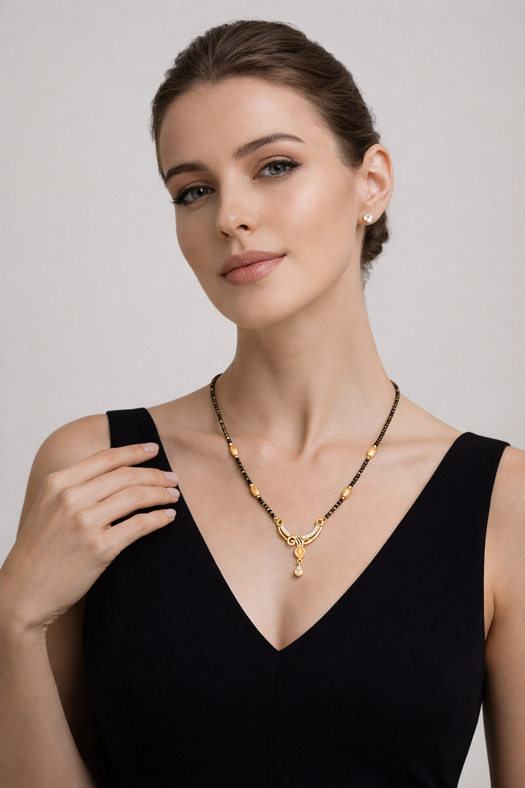 Gold-Plated Curved Leaf Mangalsutra with American Diamond Drop Pendant for Women