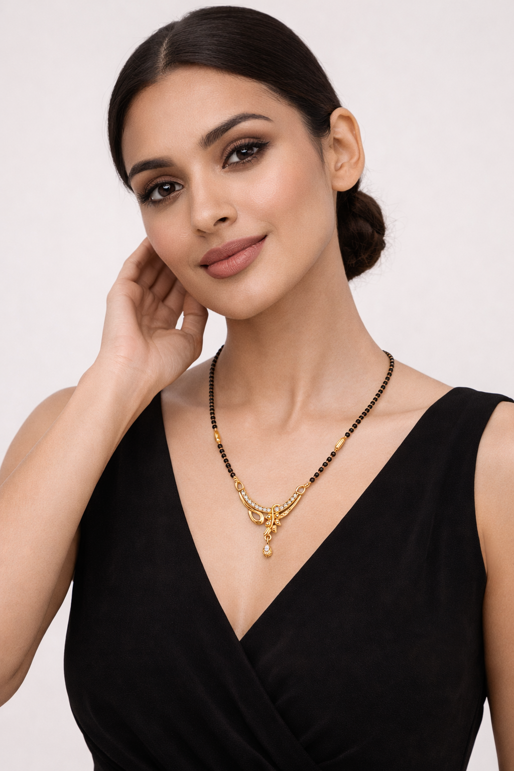 Gold-Plated Curved Designer Mangalsutra with American Diamond Drop Pendant for Women