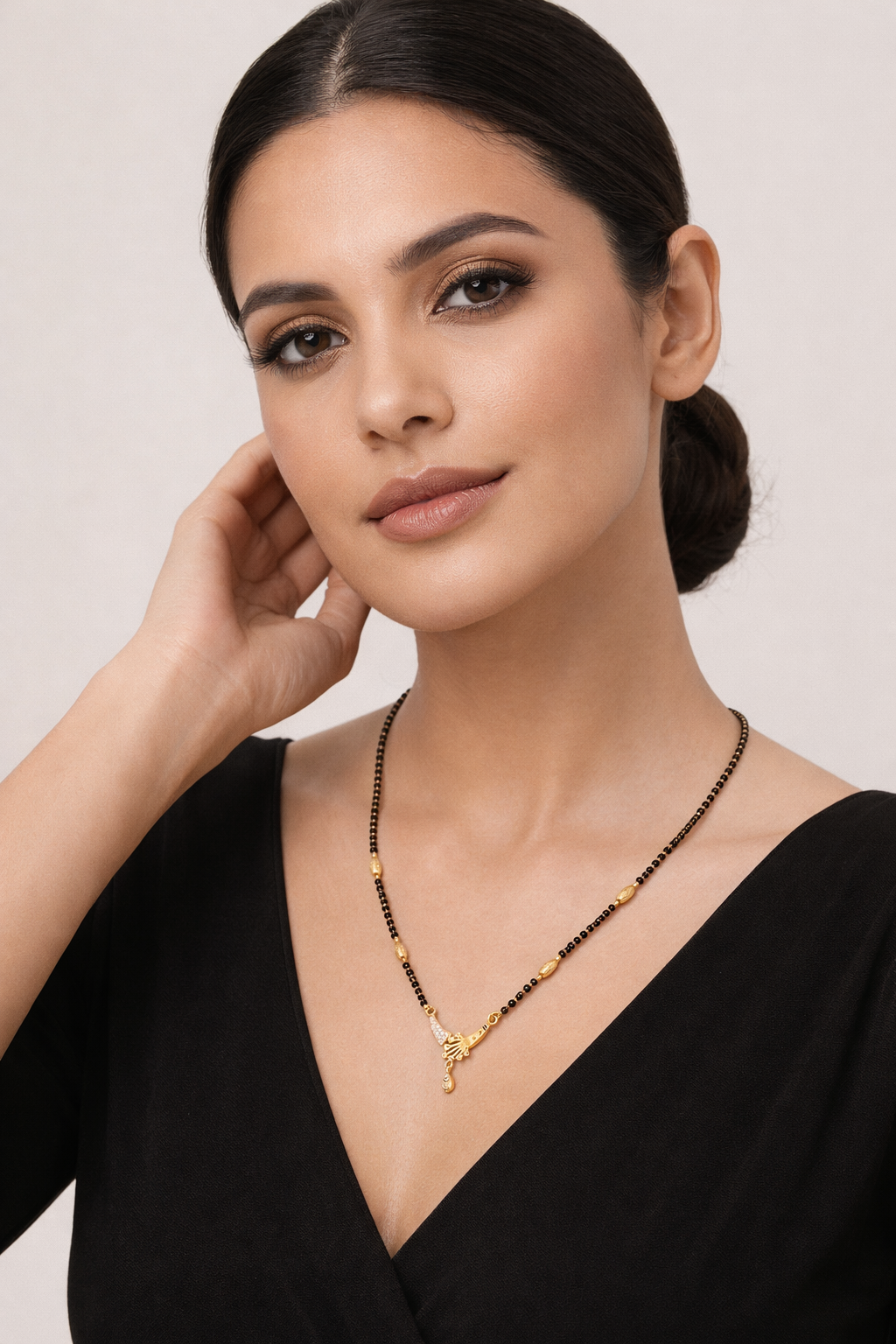 Gold-Plated Designer Mangalsutra with American Diamond Pendant and Black Bead Chain for Women